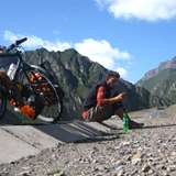Julian Sayarer cycling in the mountains