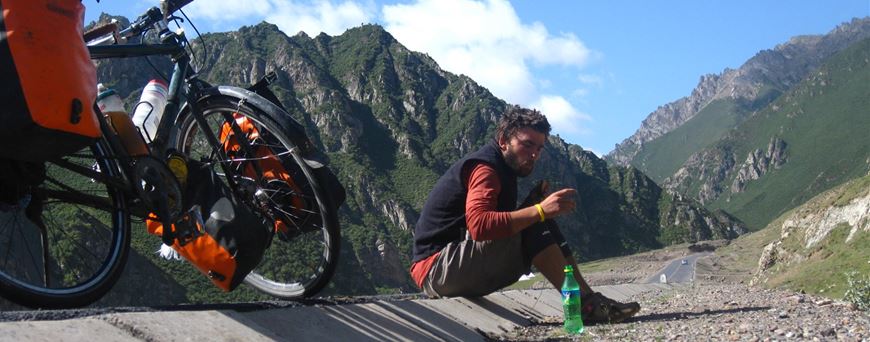 Julian Sayarer cycling in the mountains